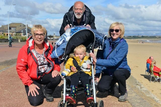 (L-R) Kate Morris, Reg Rawlinson, youngster Bradley Rawlinson, two, and Linda Rawlinson made the most of Monday's good weather with a walk along the seafront.