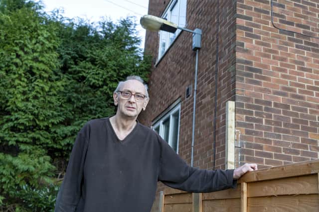 Brian Gleadless outside his home where his streetlight was broken for four years. Picture Scott Merrylees