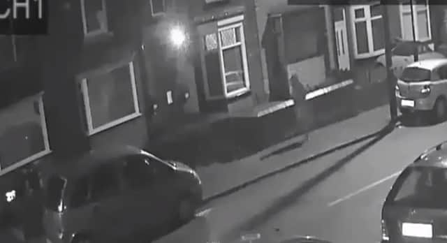 The footage shows a man in a 'dressing gown' on Bellhouse Road.