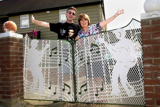 Jim & Margaret Chambers pictured in 2002 with their Elvis Presley Gates they have had made for the front and rear of his home in Ellis Cres, Brampton Bierlow