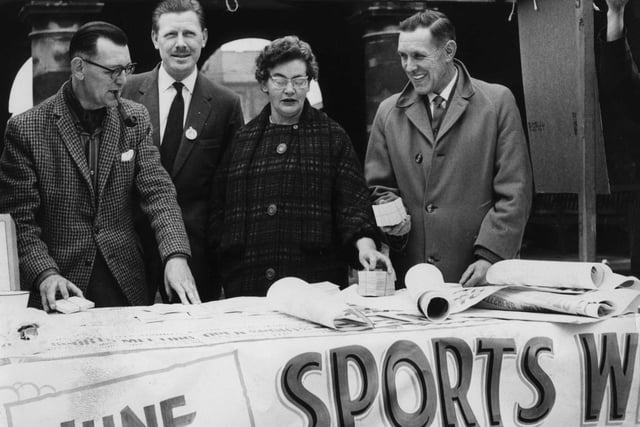 Setting up their South Shields Sports Week stall in the Maket Place in 1964 were, left to right:  Coun J Marshall, treasurer;  Norman Bell, secretary; Mrs Marshall; Ald J A Clark, chairman of South Shields Sports Week committee.