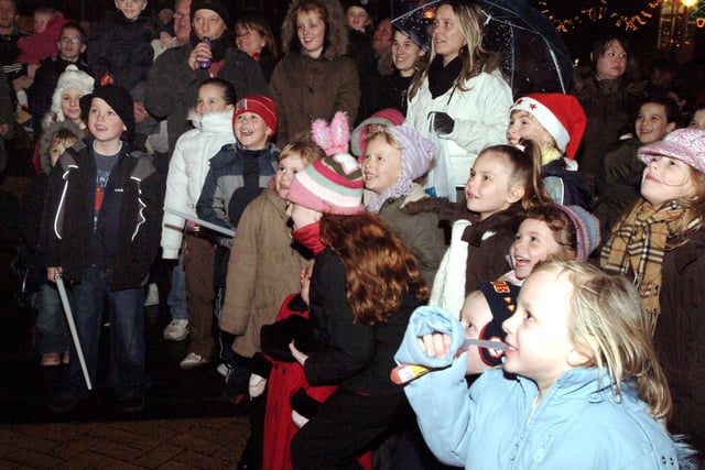 The crowds enjoying the Punch and Judy show at Sutton light switch-on.