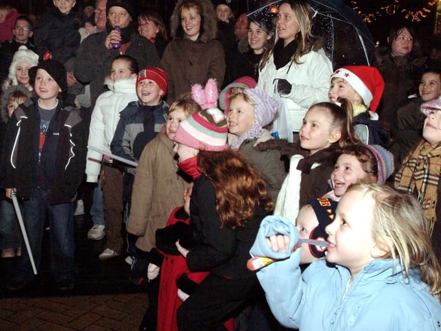 The crowds enjoying the Punch and Judy show at Sutton light switch-on.