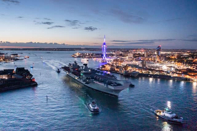HMS Queen Elizabeth departs the bright lights of Portsmouth
Picture: Shaun Roster