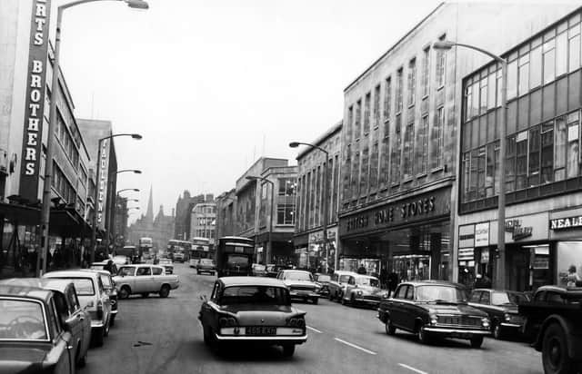The Moor, Sheffield, showing Robert Brothers Department Store, Rockingham House, British Home Stores and Pauldens, February 1966