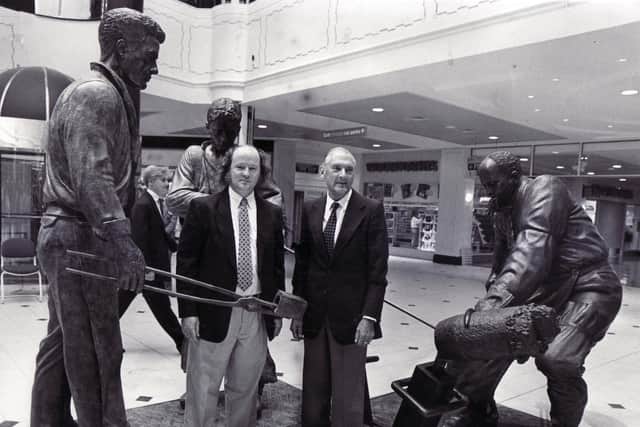 Sheffield teemer George Dalton, left, and sculptor Robin Bell with the bronze figures that were unveiled by Mr Dalton at Meadowhall in September 1990