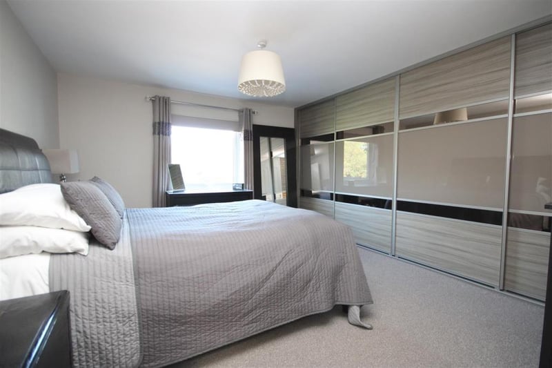The masted bedroom features fitted wardrobes and has beautiful views of the rear gardens.