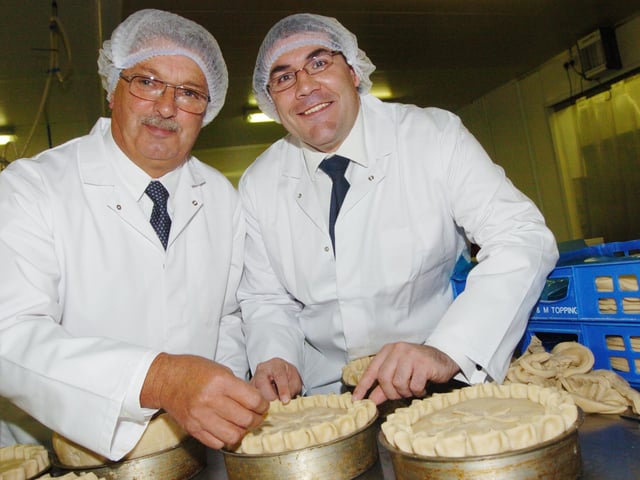 Roger Topping and Mayor Martin Winter put the finishing touches to one of Topping's Pie Company's famous pies, after officially opening the factory in 2007