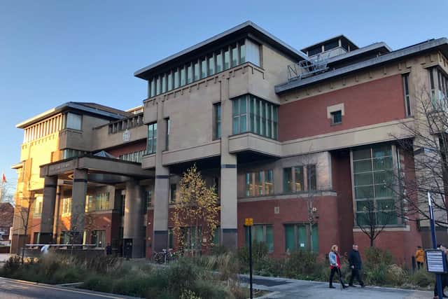 A son has been fined during at Sheffield Magistrates' Court hearing sitting at Sheffield Crown Court, pictured, after he breached a domestic violence order.