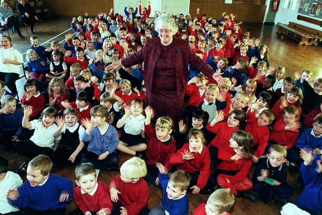 Charnock Hall Primary School head teacher, Mary Warriss, pictured with some of the infant children as she retires after 16 years at the school (December 1998)