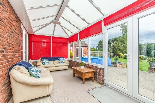 Cosy and comfortable are the words that spring to mind when stepping into the conservatory. Made of brick and uPVC, it has a ceramic tiled floor, while double-glazed French windows lead into the back garden.