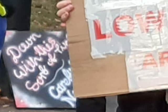 The hidden sign at the Unite picket line at Rother Valley Way says: "Down with this sort of thing. Careful now"