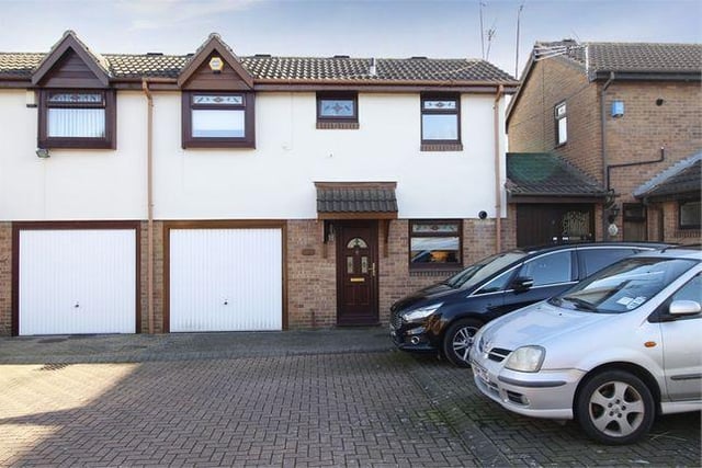 This two bedroom semi-detached house has a garage and a conservatory.