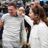 BROOKLINE, MASSACHUSETTS - JUNE 19: Matt Fitzpatrick (C) of England is congratulated on his victory by brother Alex Fitzpatrick (3rd L) as he walks off the 18th green during the final round of the 122nd U.S. Open Championship at The Country Club on June 19, 2022 in Brookline, Massachusetts. (Photo by Rob Carr/Getty Images)
