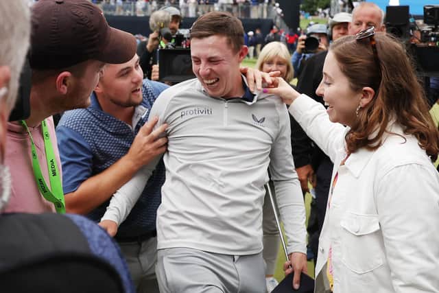 BROOKLINE, MASSACHUSETTS - JUNE 19: Matt Fitzpatrick (C) of England is congratulated on his victory by brother Alex Fitzpatrick (3rd L) as he walks off the 18th green during the final round of the 122nd U.S. Open Championship at The Country Club on June 19, 2022 in Brookline, Massachusetts. (Photo by Rob Carr/Getty Images)