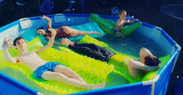 Gayle Leishman's children Ryan, Ross, Enma-Rae and Elliott chill out in an inflatable pool in their back garden.