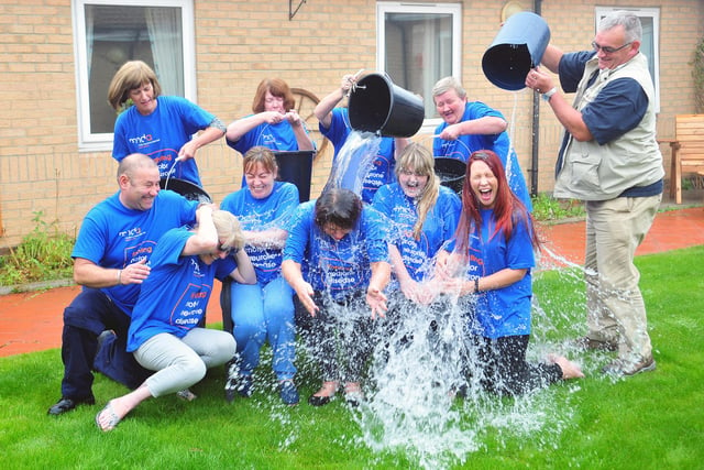 Staff from Fieldview care home taking part in the challenge. And look at their reaction as they get a soaking!