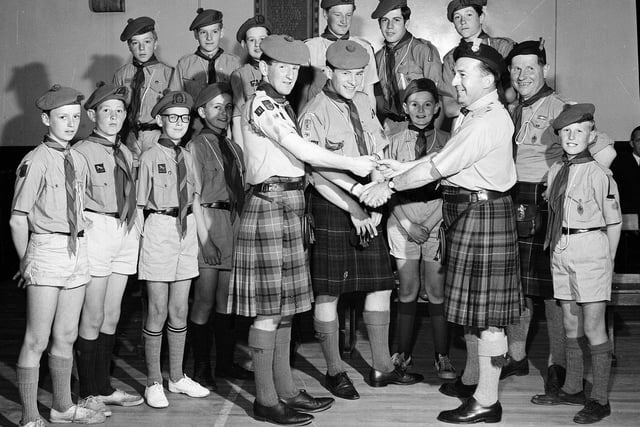 Mr Gordon Sims presents Queen's Scout badges to Scouts of the 111th Inverleith Troop in November 1964.