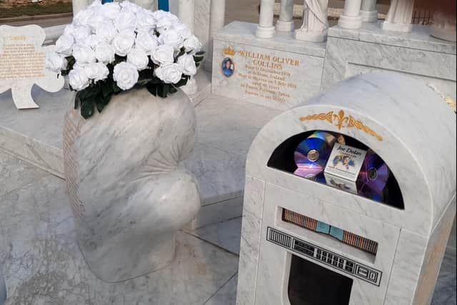 The juke box and a 1.5 ton marble boxing glove at the Willy Collins memorial at Shiregreen Cemetery, Sheffield