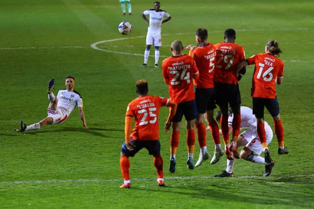 Lewis Wing of Rotherham United slips as he takes a freekick during the Sky Bet Championship match between Luton Town and Rotherham United at Kenilworth Road.  (Photo by Richard Heathcote/Getty Images)
