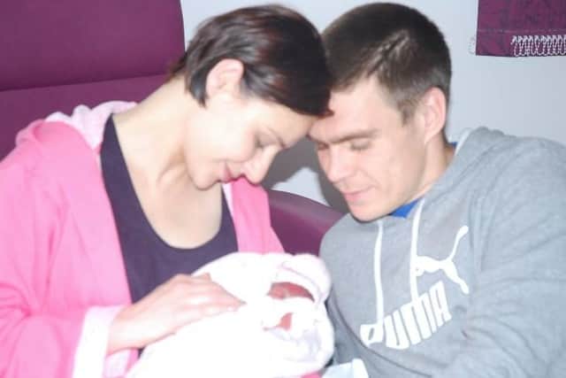 Emma and her husband Matthew with their first child Annie