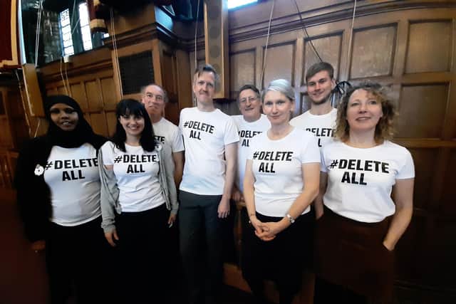 Coun Alison Teal with fellow Green councillors, protesting via t-shirts at a Town Hall meeting.