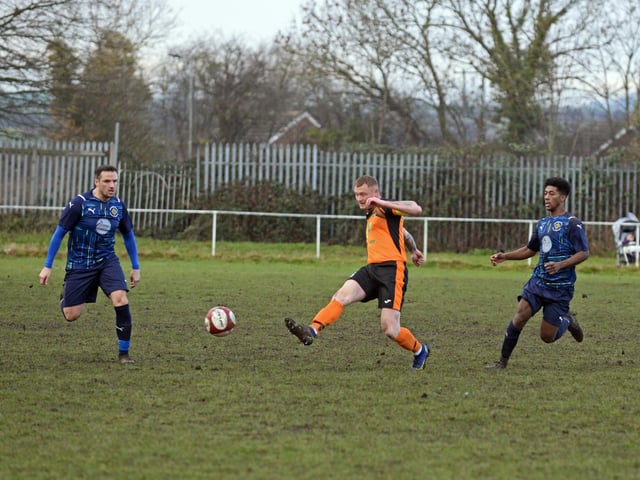 Scawthorpe skipper Gary Mundy keeps possession for his side.
