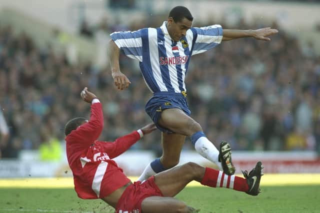 Phil Babb of Liverpool slides in to tackle Mark Bright of Sheffield Wednesday during an FA Carling Premiership match at the Hillsborough Stadium in Sheffield. Shaun  Botterill/Allsport