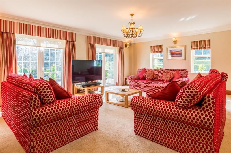 The impressive drawing room provides another space for relaxing and entertaining, and includes a curved bay window with French doors on either side which provide access to the sun terrace.