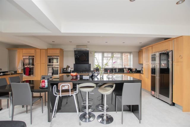 An island in the middle of the kitchen is perfect for casual dining. The room also boasts all the modern amenities and appliances that you need.