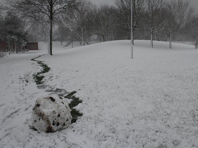 An abandoned boulder of snow makes for an eerie scene.