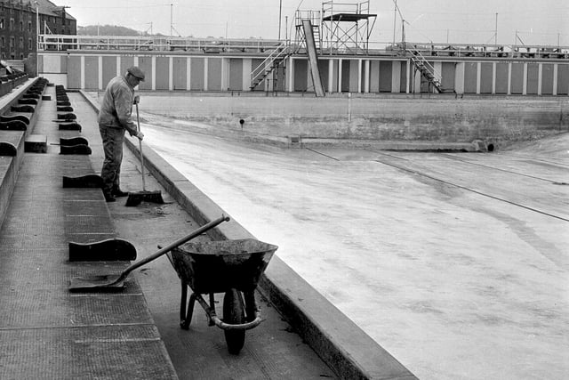 A worker is pictured cleaning North Berwick's outdoor pool in preparation for the summer season ahead in April 1964.