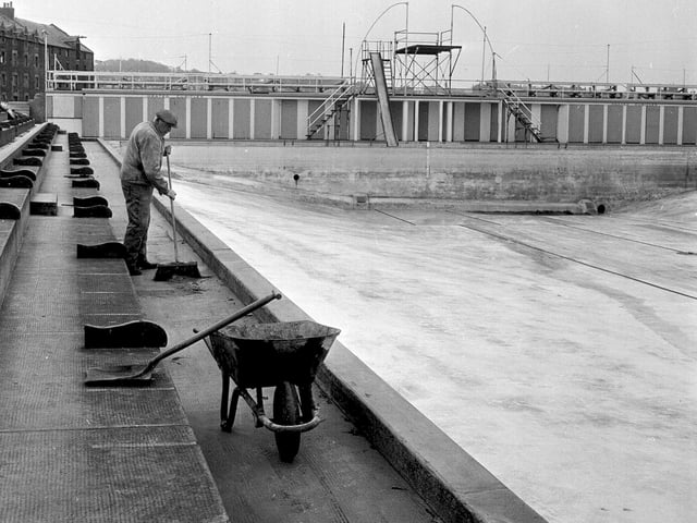 A worker is pictured cleaning North Berwick's outdoor pool in preparation for the summer season ahead in April 1964.
