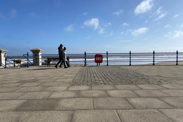 A couple take in the sea air at Seaton on Monday morning.