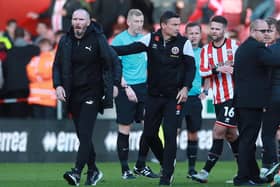 Paul Heckingbottom, manager of Sheffield United, and Blackpool boss Michael Appleton after a post-match brawl at Bramall Lane: Simon Bellis / Sportimage