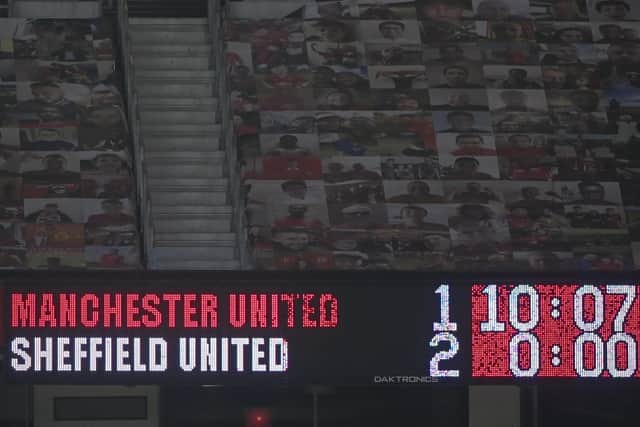 Scoreboard shows final score in the English Premier League soccer match between Manchester United and Sheffield United at Old Trafford (AP Photo/Laurence Griffiths,Pool)
