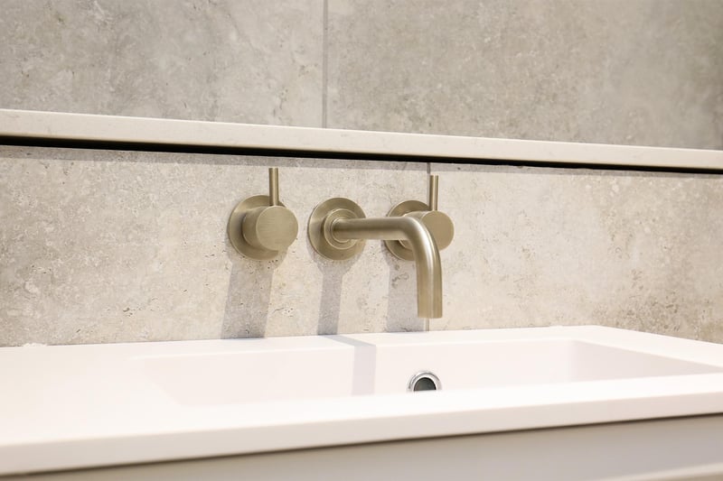 With tasteful taps and tiling, the bathroom completes the contemporary design.
