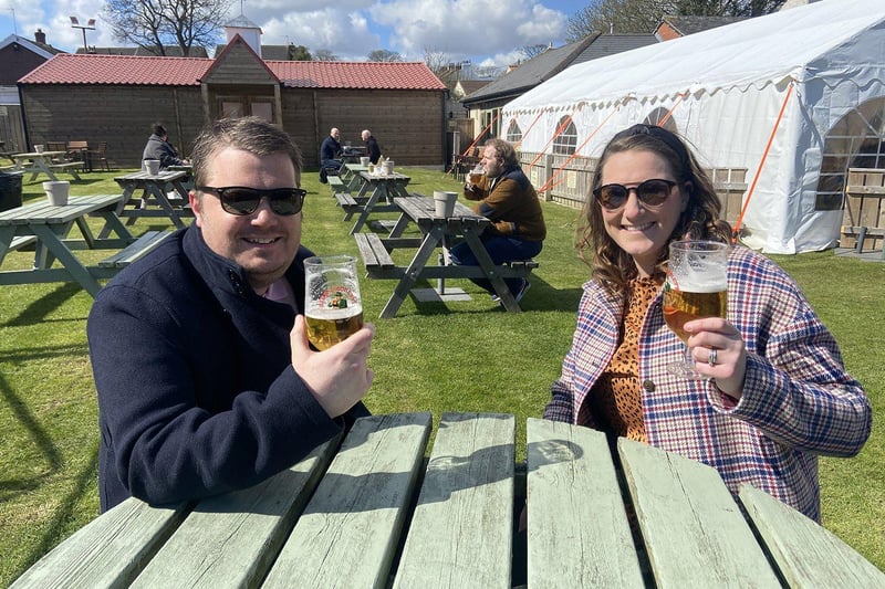 Anyone for a pint? Simon and Claire Hoey celebrating the easing of lockdown with a pint in the beer garden at the Raby Arms, Hart Village. Picture by Frank Reid