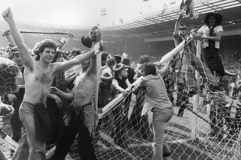 The Tartan Army invade the pitch and pulling down the goalposts after Scotland beat England 2-1 at Wembley in April 1967