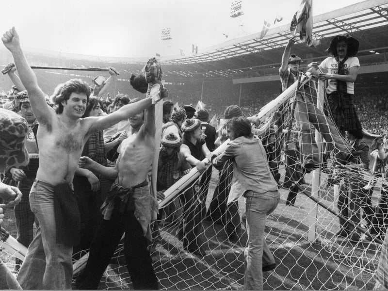 The Tartan Army invade the pitch and pulling down the goalposts after Scotland beat England 2-1 at Wembley in April 1967