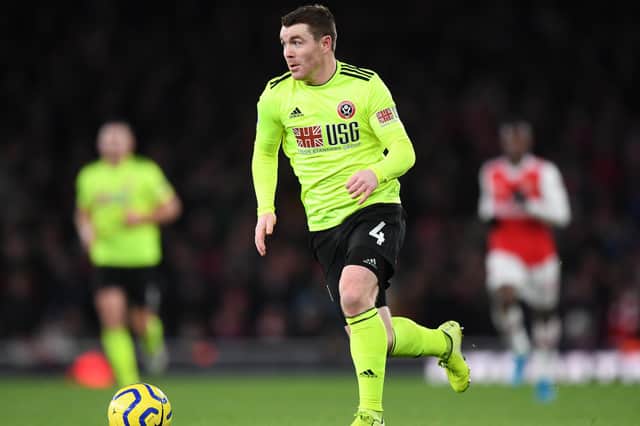 Blades midfielder John Fleck has signed a new contract.