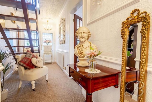 Even the entrance hallway at the Abbott Road property is blessed with style. It boasts a carpeted floor and a central-heating radiator. We're not too sure who the bust is of, though!