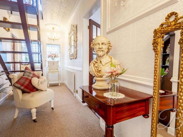 Even the entrance hallway at the Abbott Road property is blessed with style. It boasts a carpeted floor and a central-heating radiator. We're not too sure who the bust is of, though!