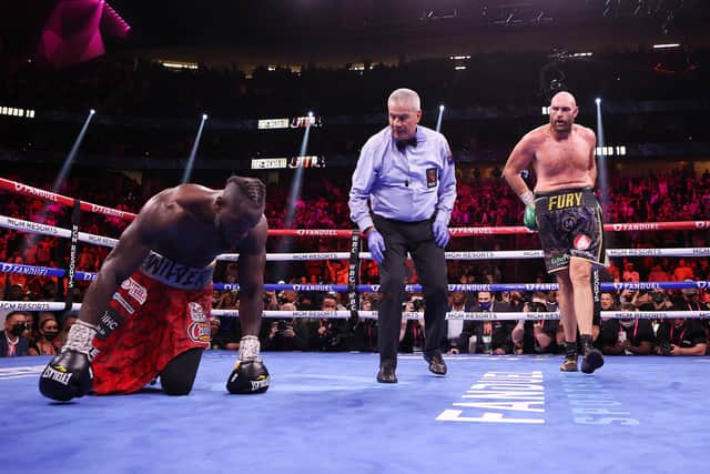 Tyson Fury knocks down Deontay Wilder  in the third round during their WBC heavyweight championship at T-Mobile Arena on October 09, 2021 in Las Vegas, Nevada: Al Bello/Getty Images