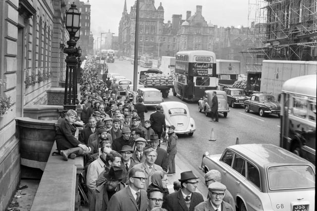 Stamp collectors queue the length of North Bridge to buy the World Cup stamps from the GPO in August 1966. 12 million of the limited edition stamps had been printed.