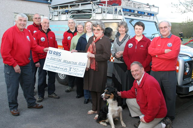 Chapel Ladies Choir president Ann Young presented a cheque to Buxton Mountain Rescue Team in 2008