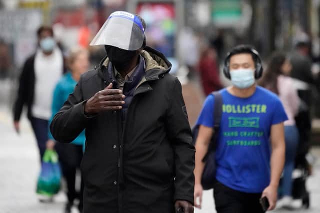 SHEFFIELD, ENGLAND - OCTOBER 22: People weart face masks and PPE on October 22, 2020 in Sheffield, England. The county of South Yorkshire, which includes the city of Sheffield will move to Tier 3 'Very High' Covid-19 alert on Saturday. (Photo by Christopher Furlong/Getty Images)