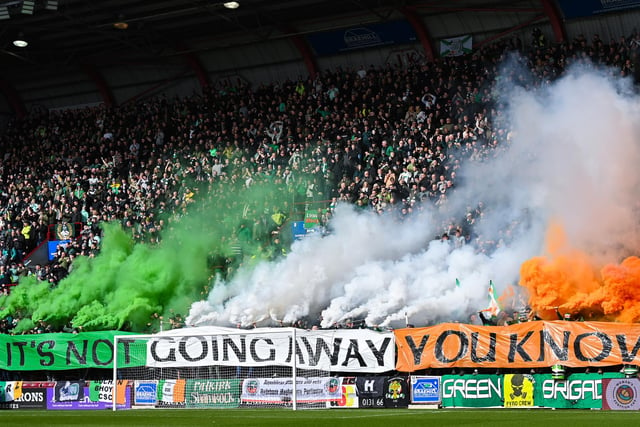 The Celtic support housed in the Roseburn Stand unfurl a banner on pyro ahead of the match against Hearts, followed by a number of flares.