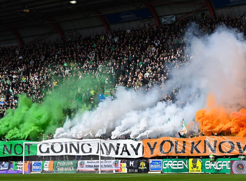 The Celtic support housed in the Roseburn Stand unfurl a banner on pyro ahead of the match against Hearts, followed by a number of flares.