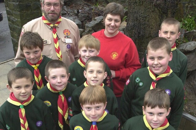 The cubs of the 290th St Gabriels are seen with  scout master Clive Wardare cub leader  Christine Ward his wife, after the  boys that found £400 for a mugging while out on a bug hunt in Bingham Park.